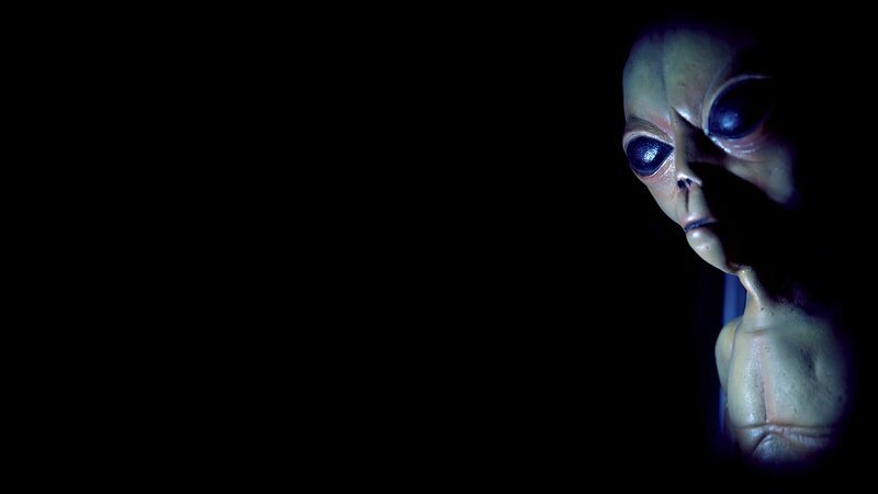 alien figure in dark setting