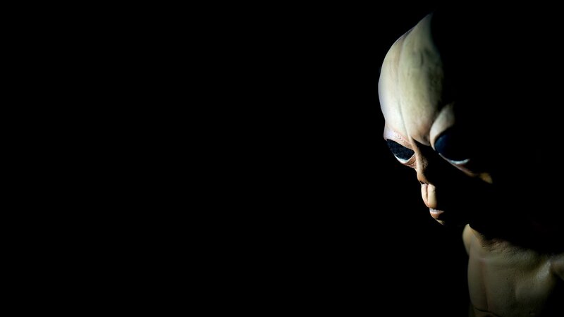 Alien Figure in Profile — Black