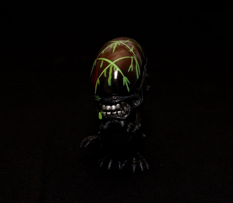 Alien figure with green markings