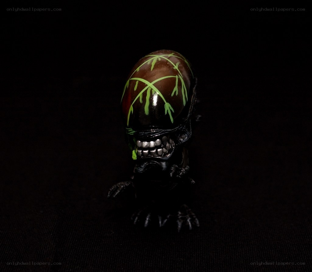 Alien figure with green markings