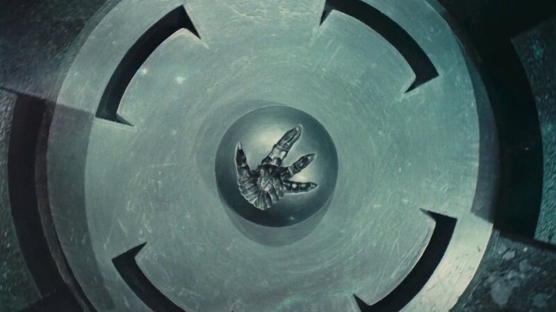 alien hand in a mechanical chamber