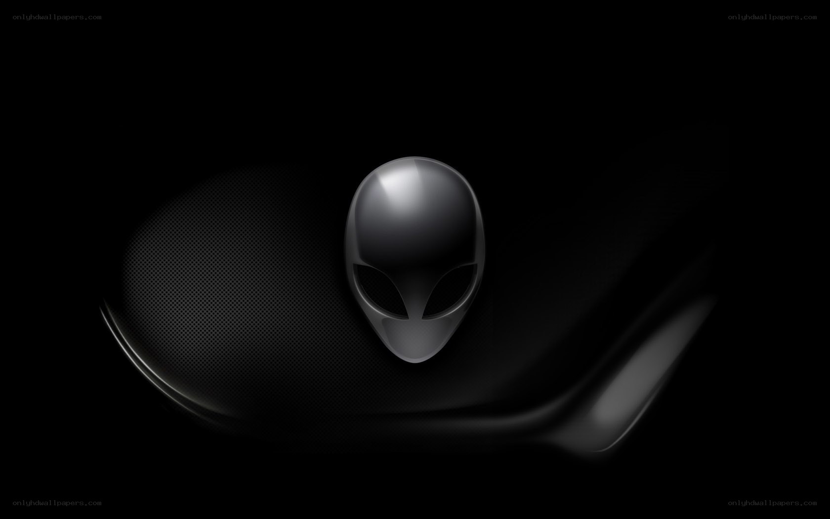 Alien head logo on dark background