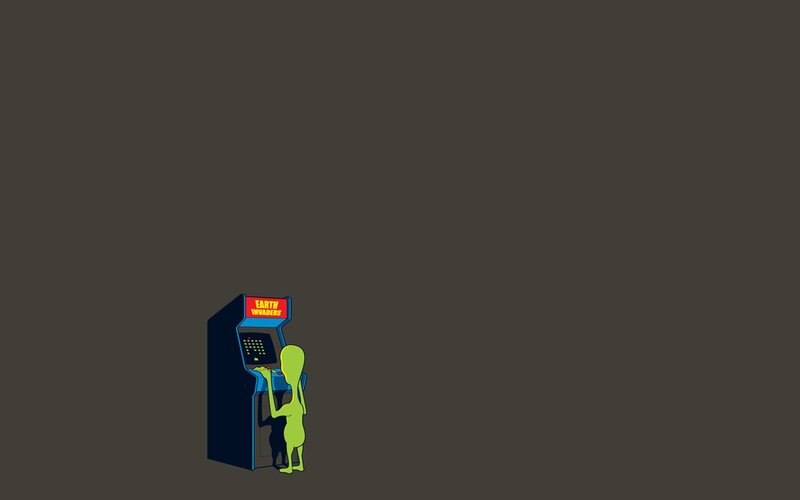 alien playing arcade game