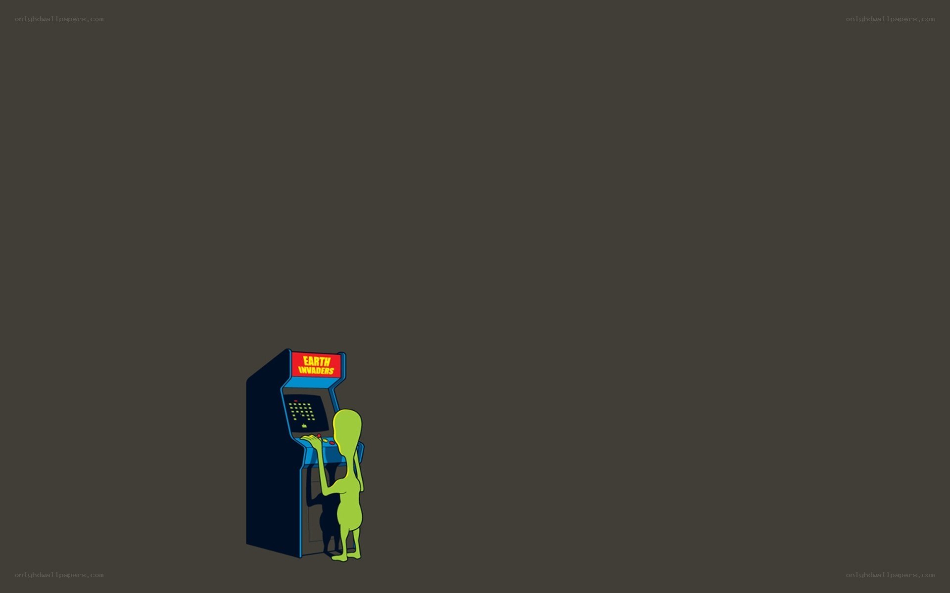 alien playing arcade game
