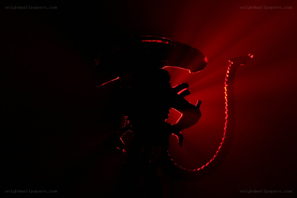 Alien silhouette in red light