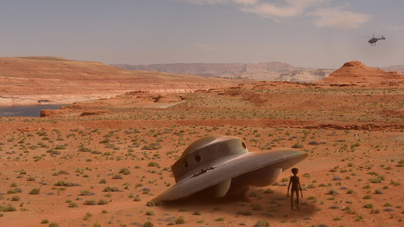 Alien Standing Beside UFO
