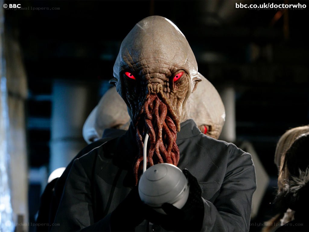 Alien with red eyes and tentacles