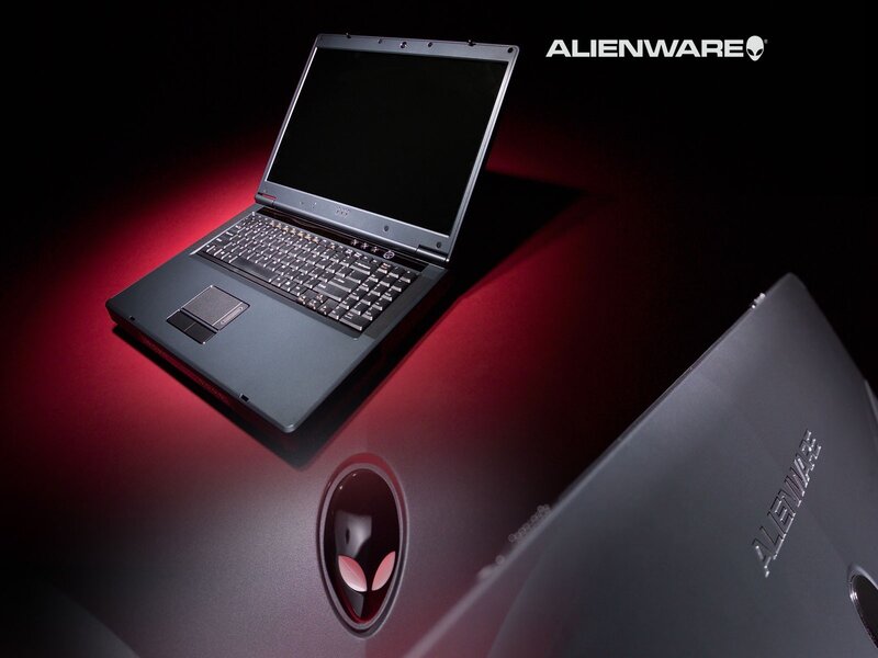 Alienware laptop on red surface
