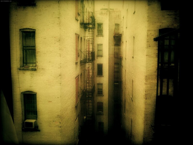 alley between brick buildings