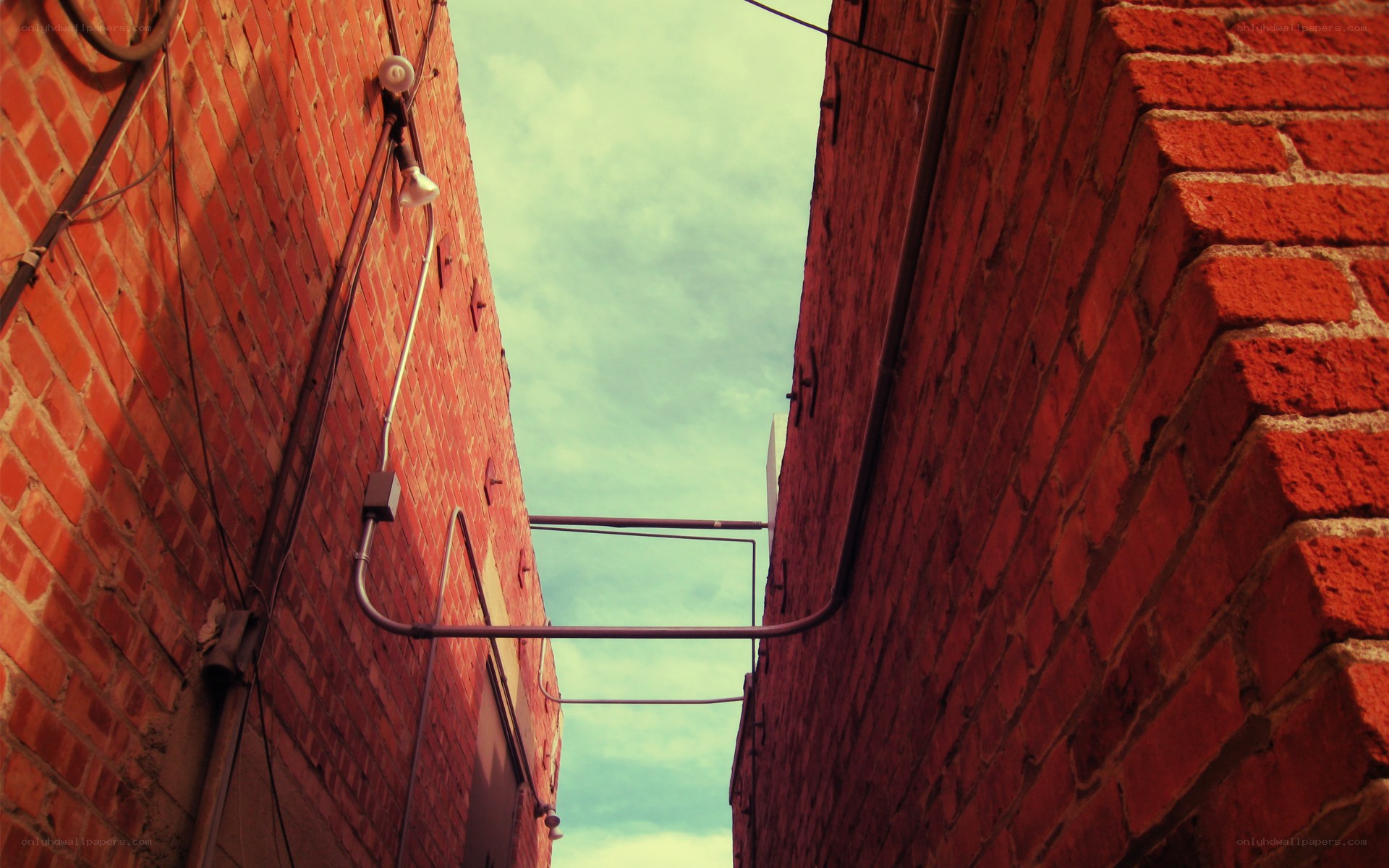 alley between brick buildings
