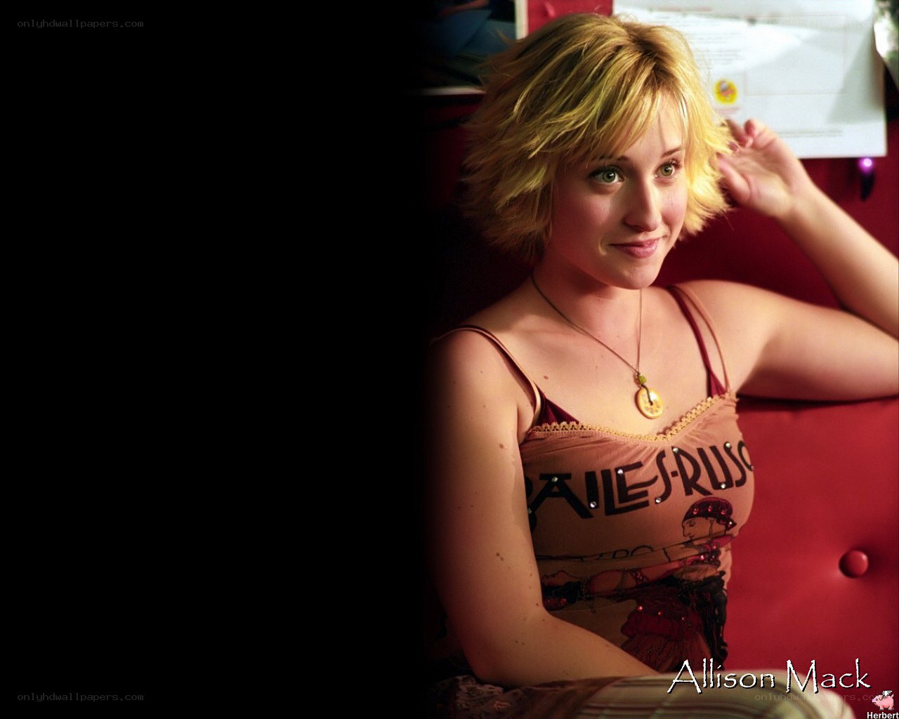 Allison Mack in a red room