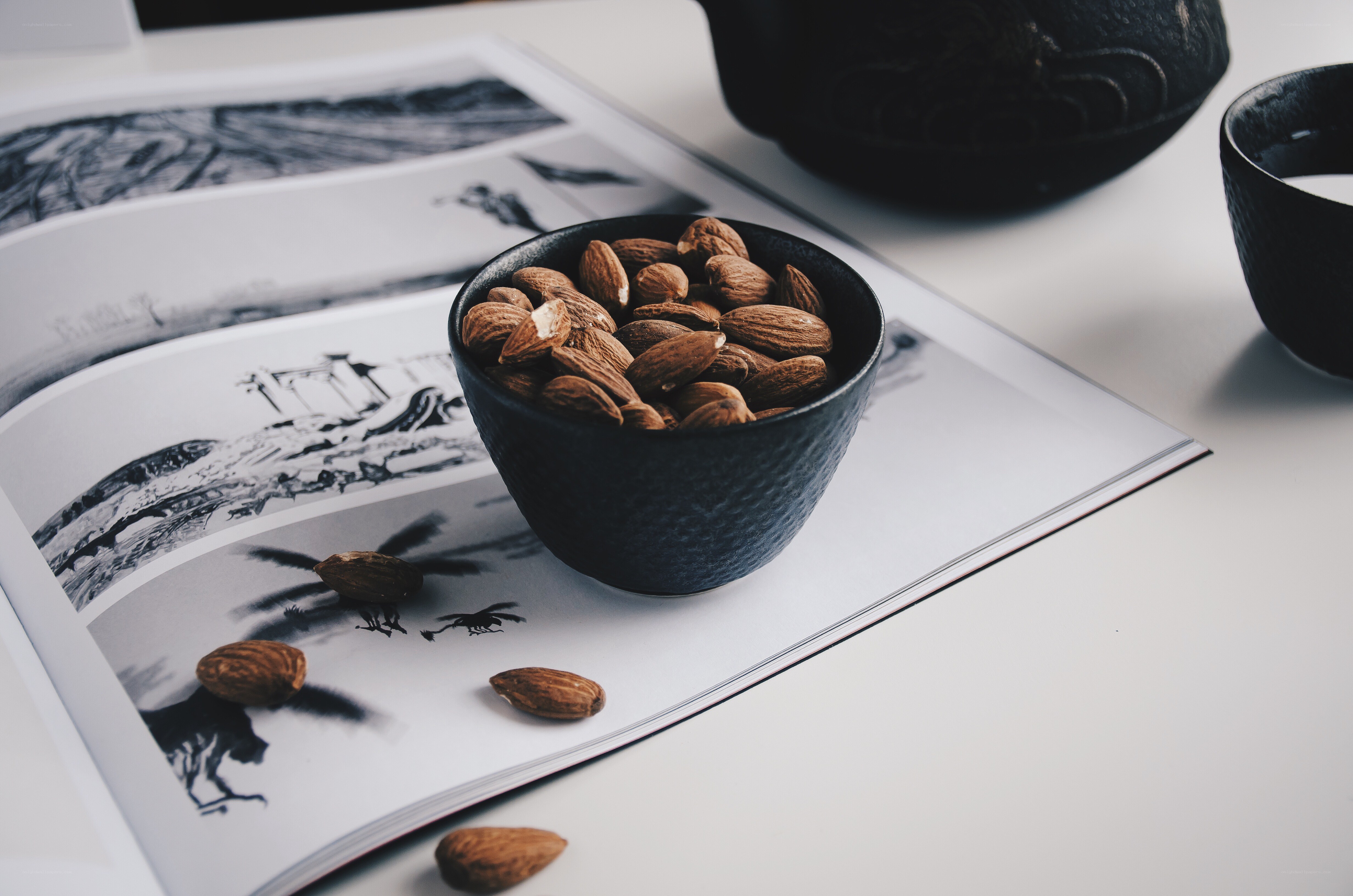 almonds in a bowl on book