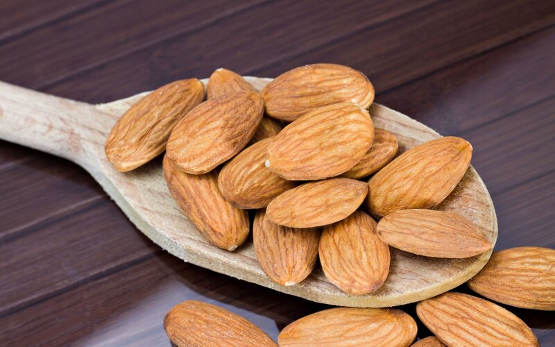 Almonds on Wooden Spoon