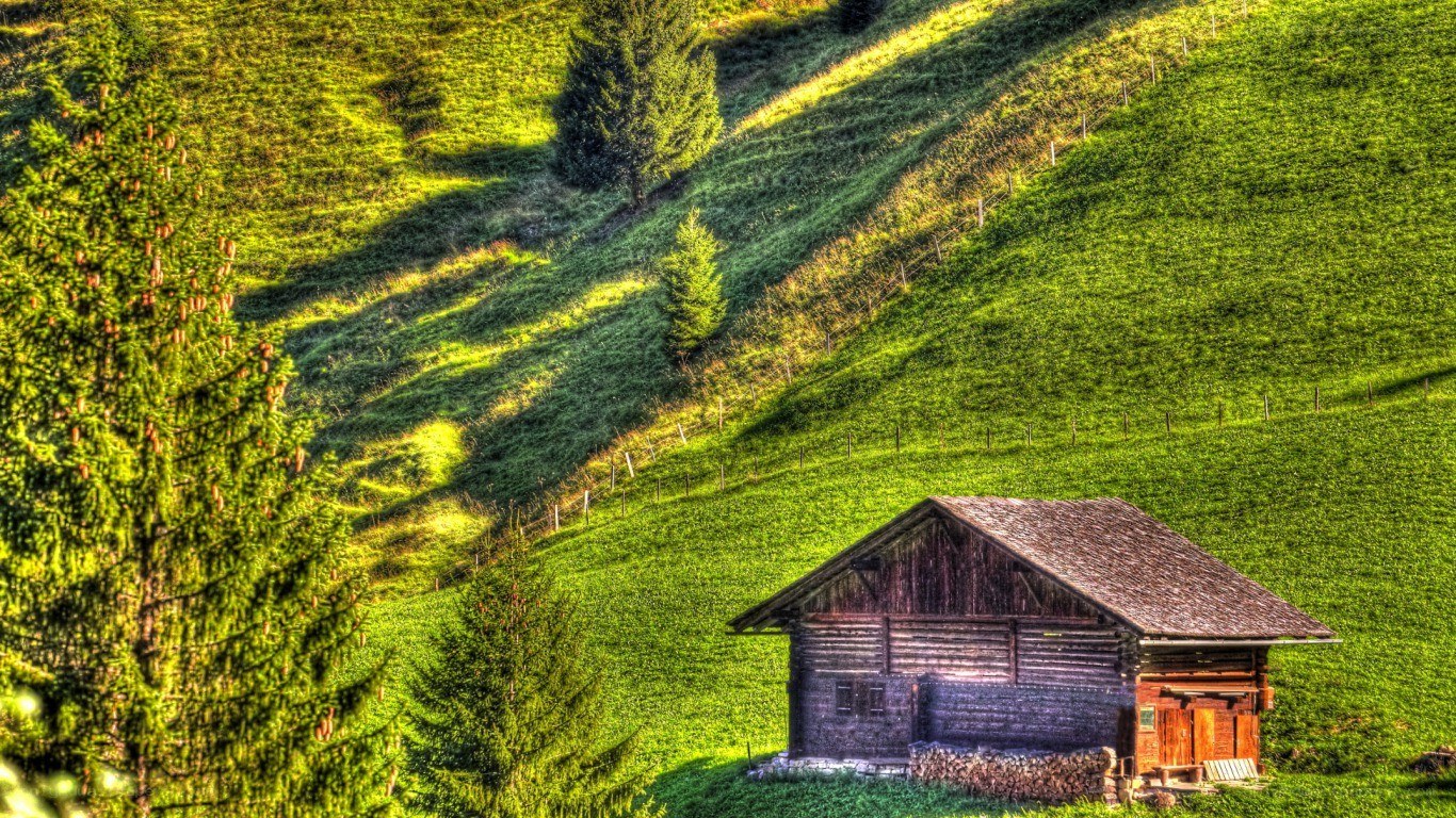 Alpine cabin on a sunny hillside