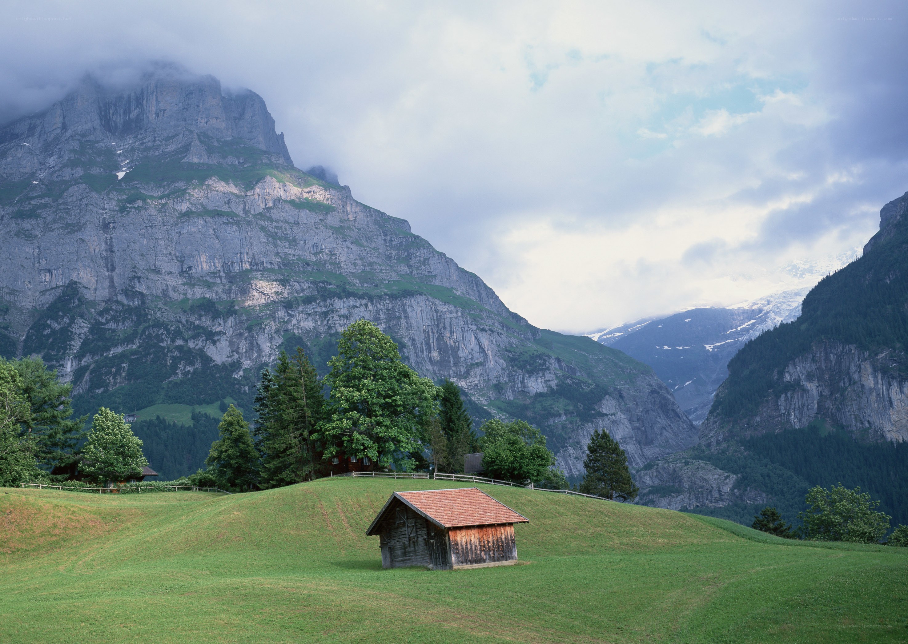 Alpine hut in mountain valley