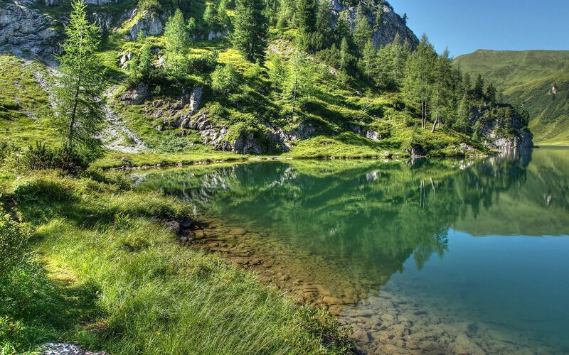 Alpine Lake and Mountains — Green, Serene, Afternoon, Photograph, Trees, Grass, Rocks, Blue, Brown