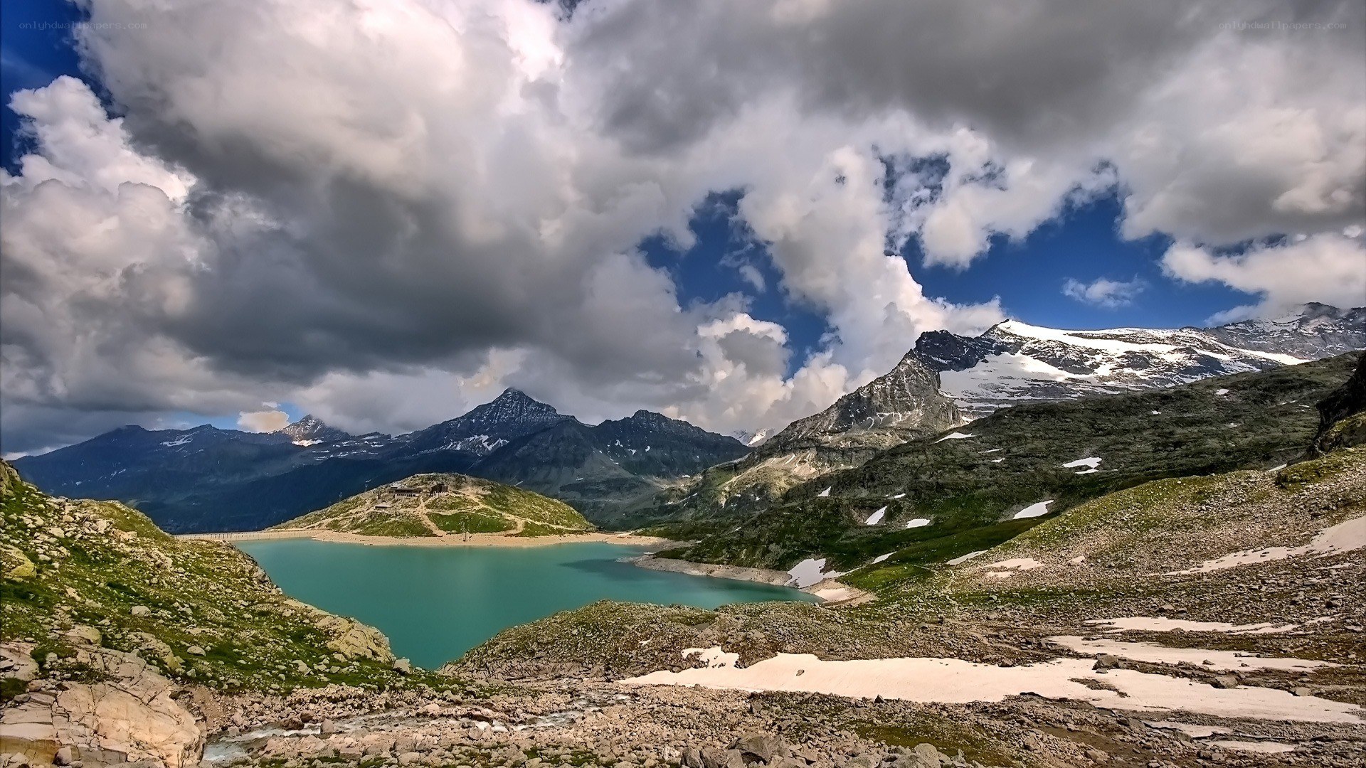 alpine lake under cloudy sky