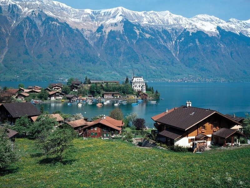 Alpine lake village with mountains