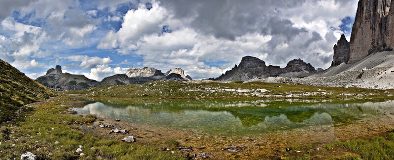 Alpine lake with mountain reflections