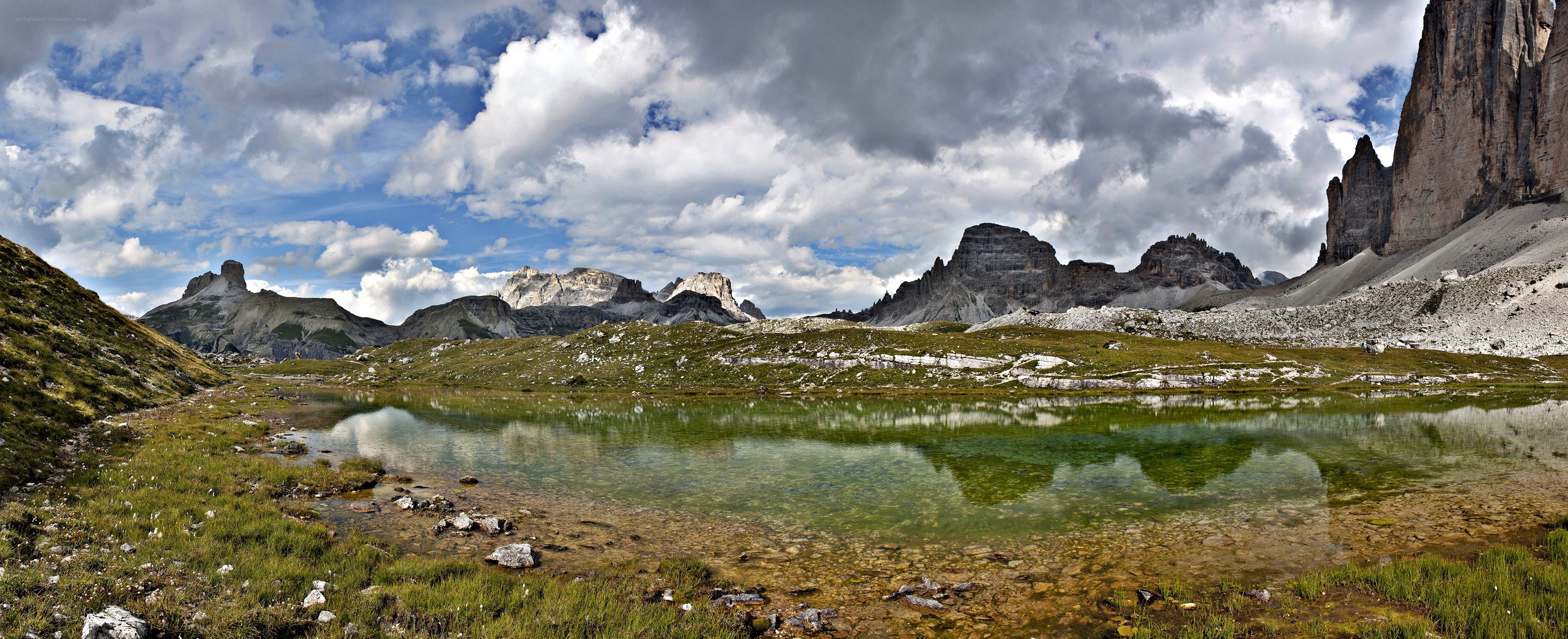 Alpine lake with mountain reflections