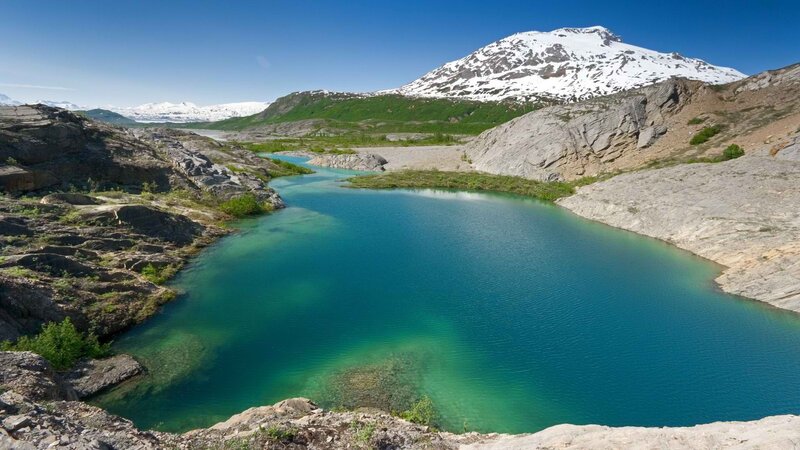 alpine lake with snow-capped mountain