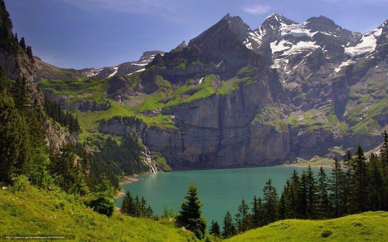 alpine lake with snow-capped mountains