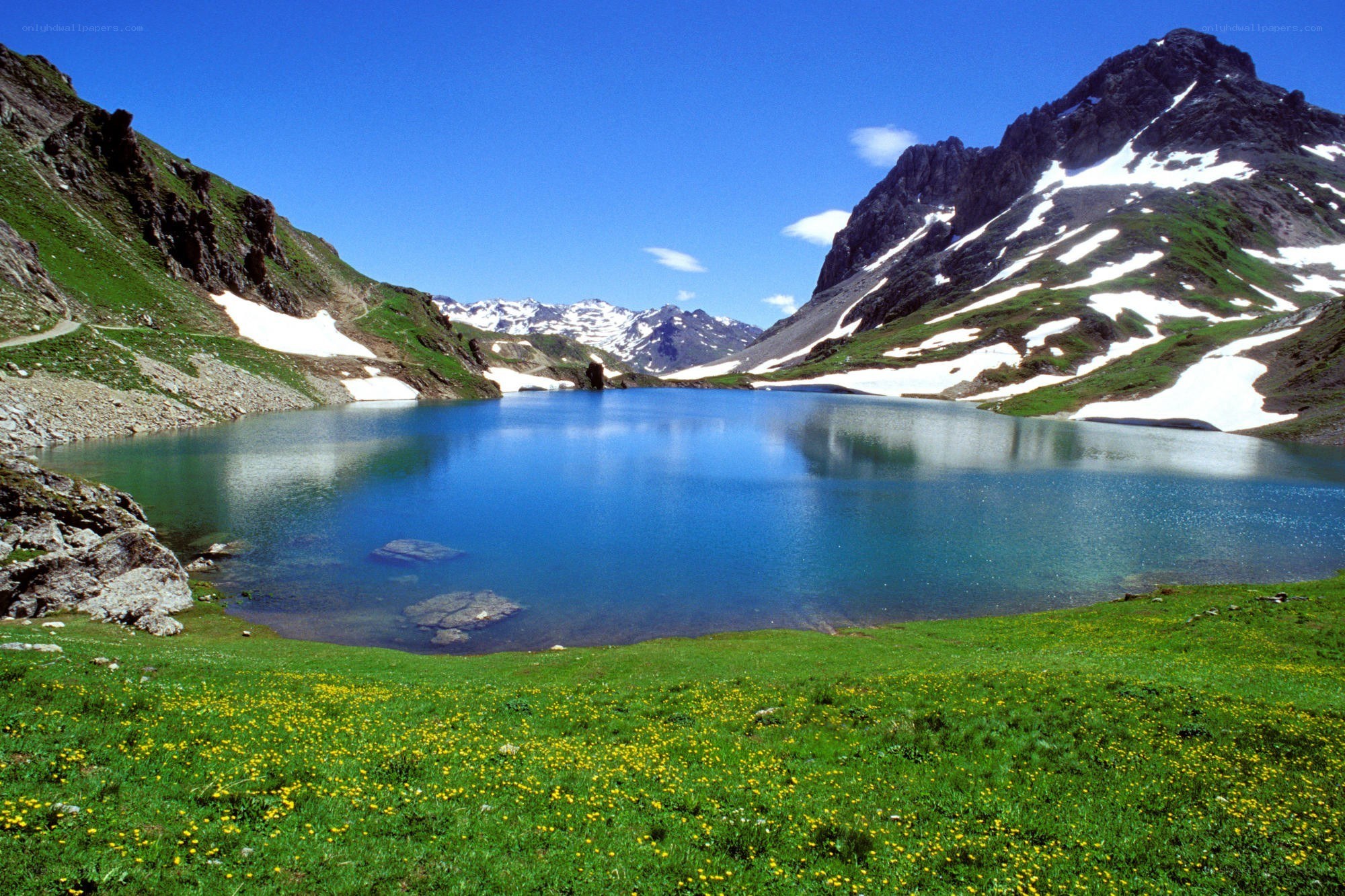 alpine lake with snow-capped mountains