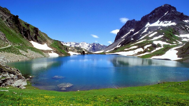 alpine lake with snow-capped mountains