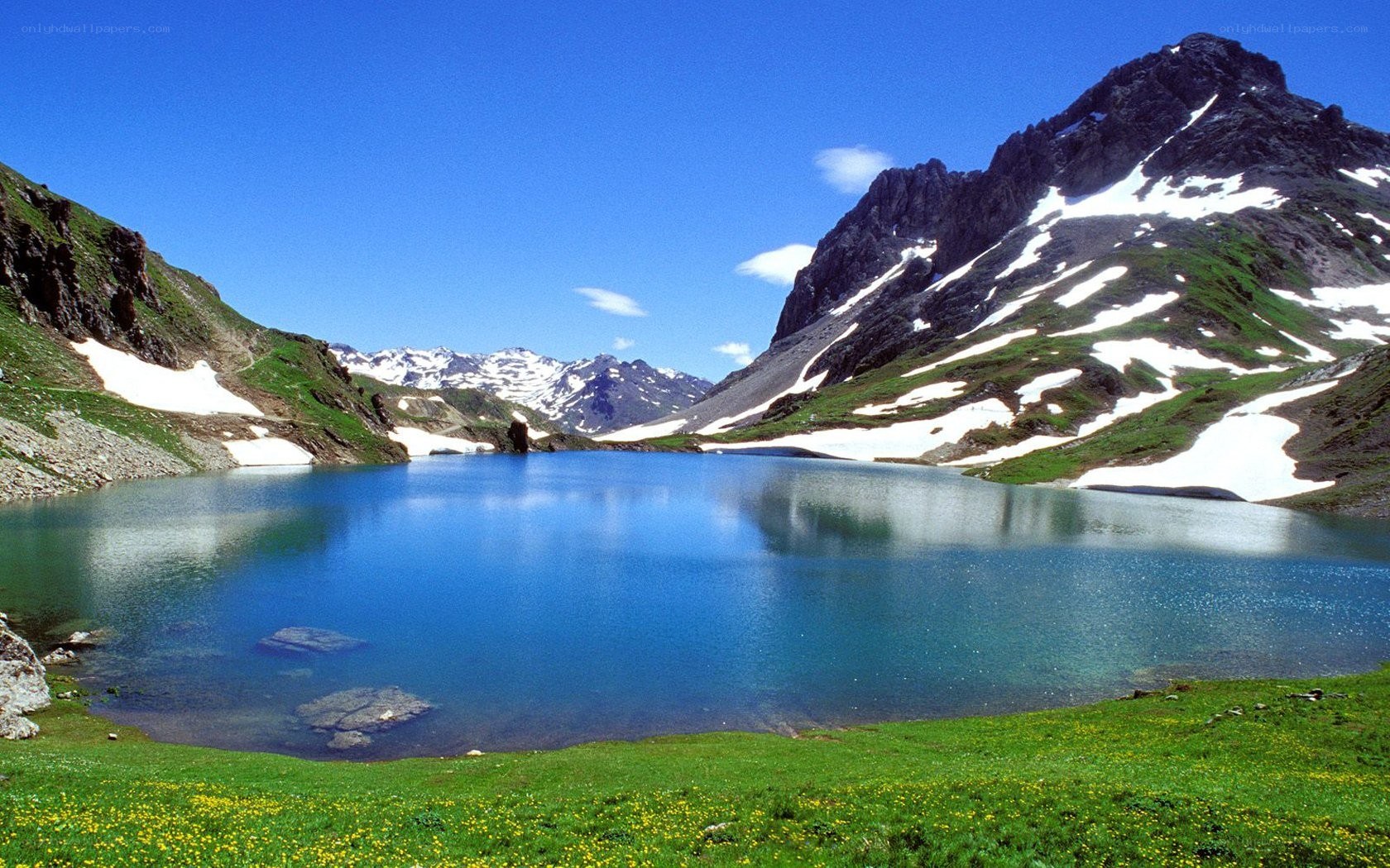 alpine lake with snow-capped mountains