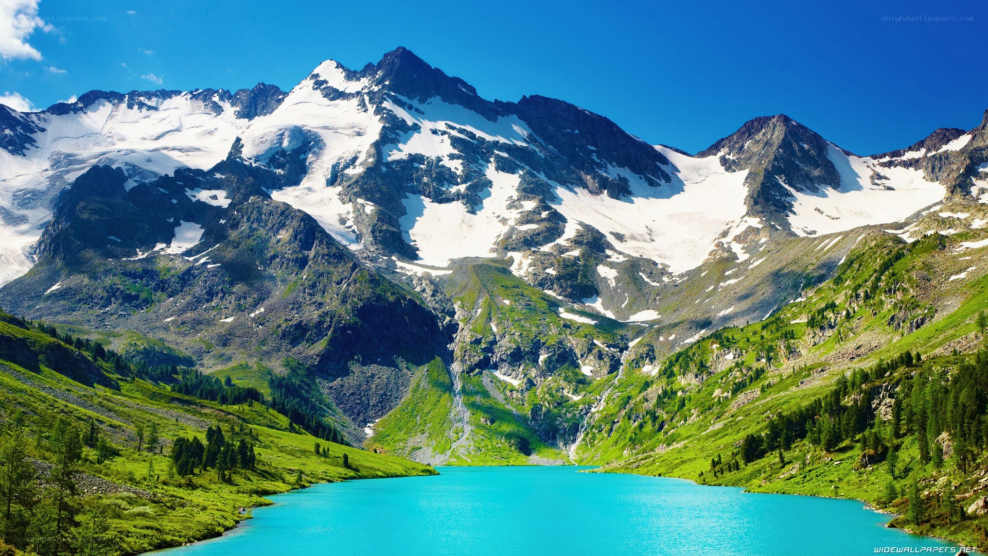 alpine lake with snow-capped mountains