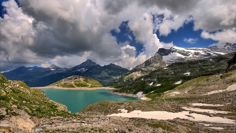 alpine lake with snow-capped mountains