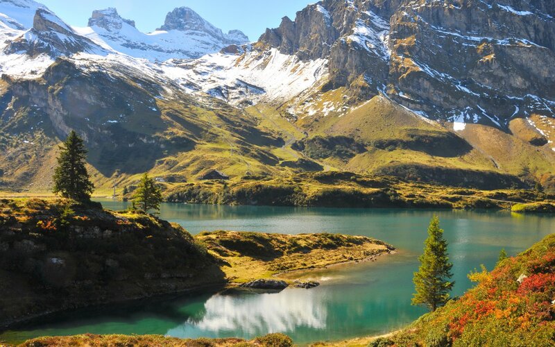 alpine lake with snow-capped mountains