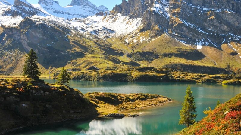 alpine lake with snow-capped mountains
