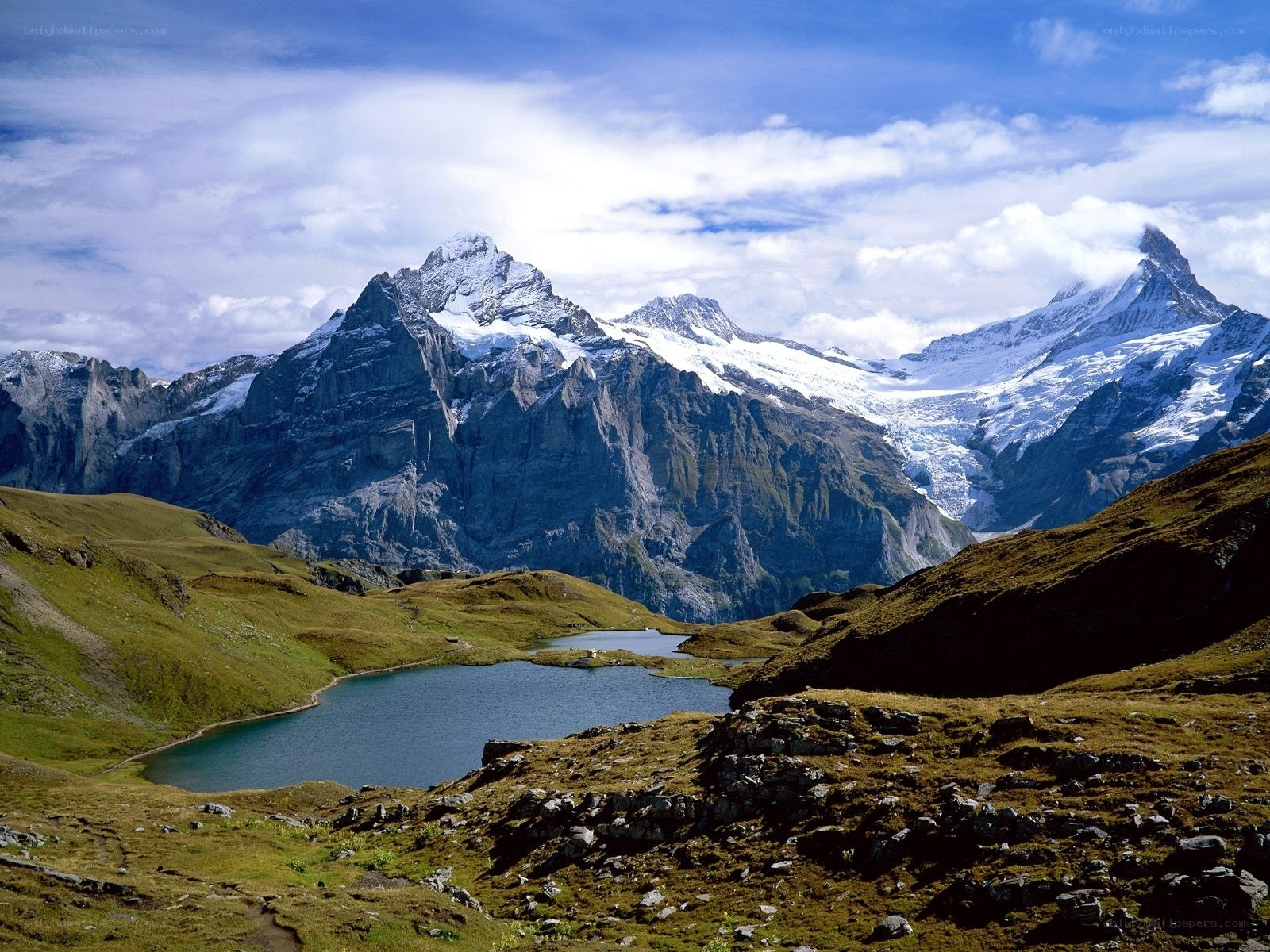 Alpine lake with snow-capped mountains