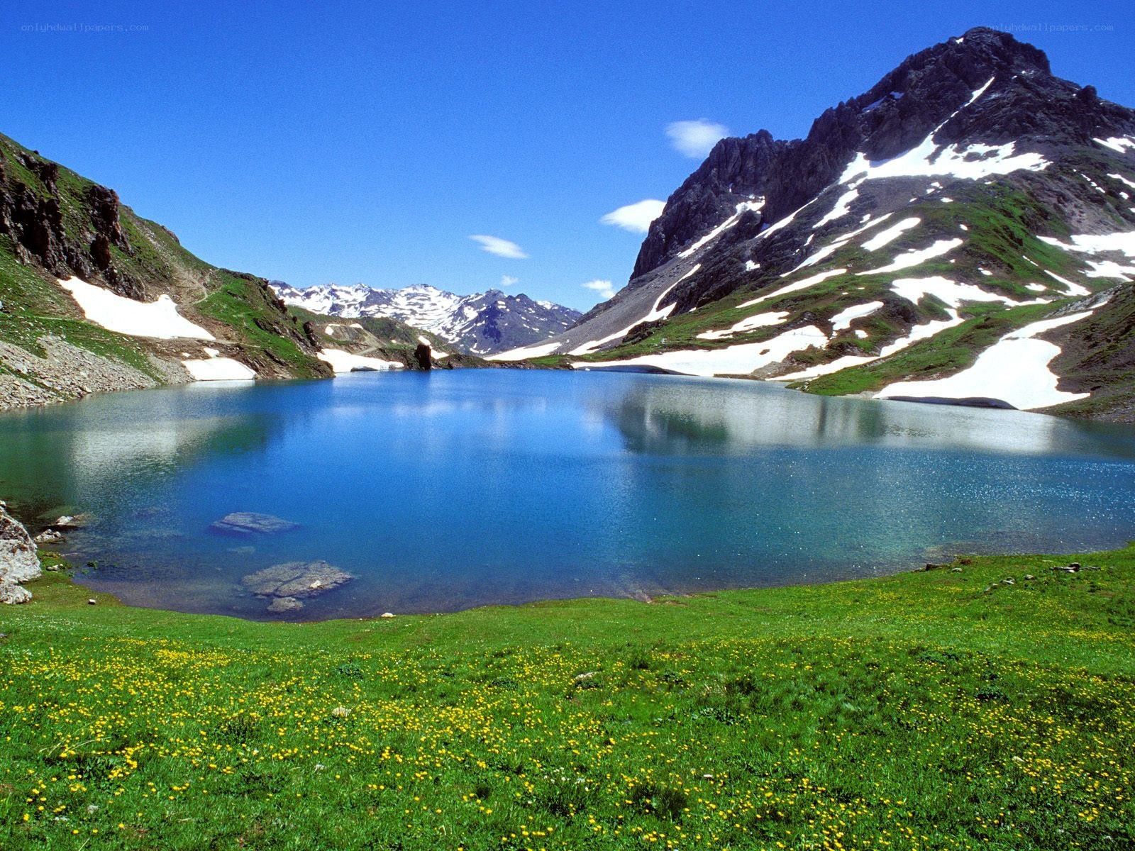 alpine lake with snow-capped mountains