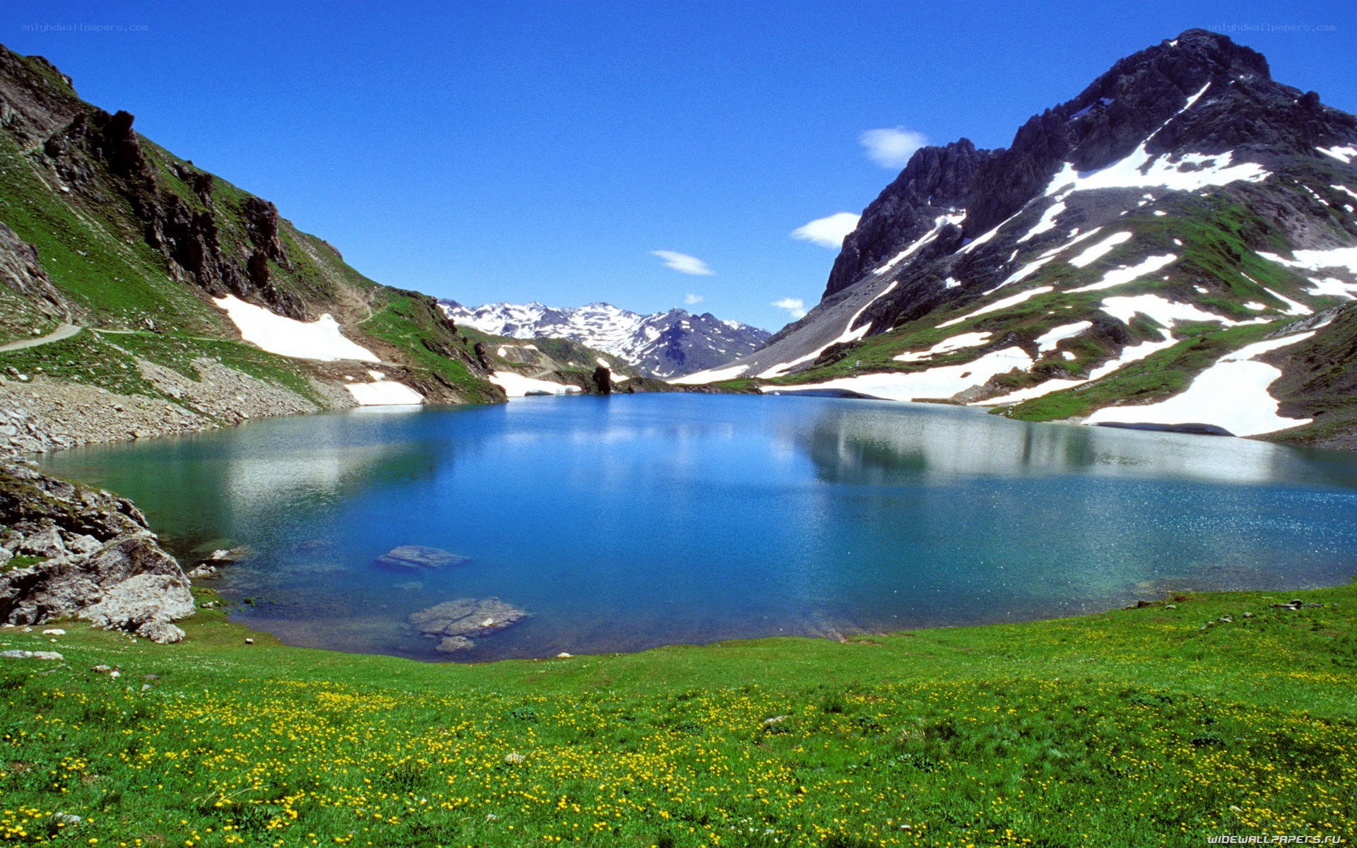 alpine lake with snow-capped mountains