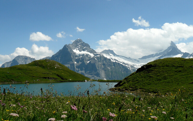 Alpine lake with snow-capped mountains