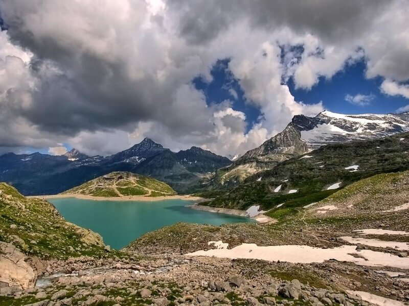alpine lake with snow-capped mountains