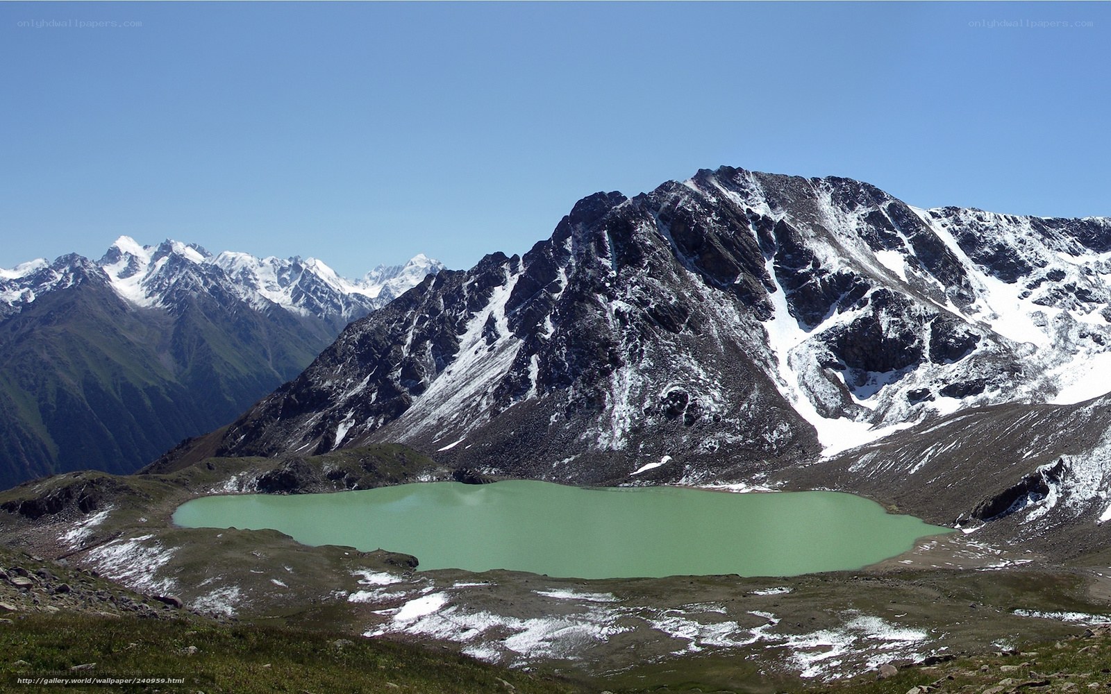 alpine lake with snow-capped mountains