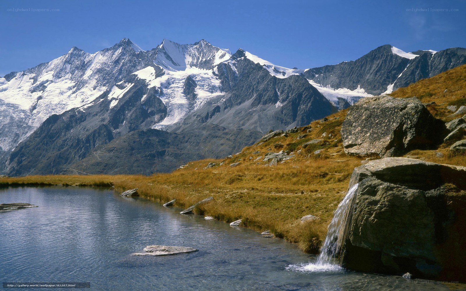 Alpine lake with snow-capped peaks