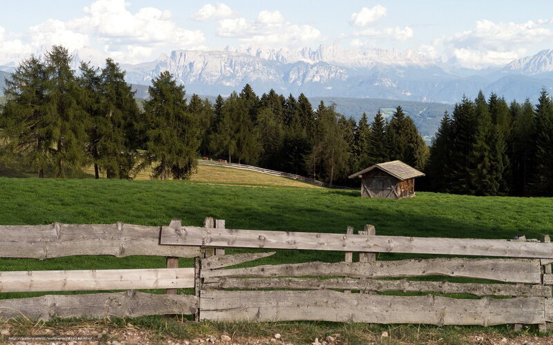 Alpine landscape with wooden fence