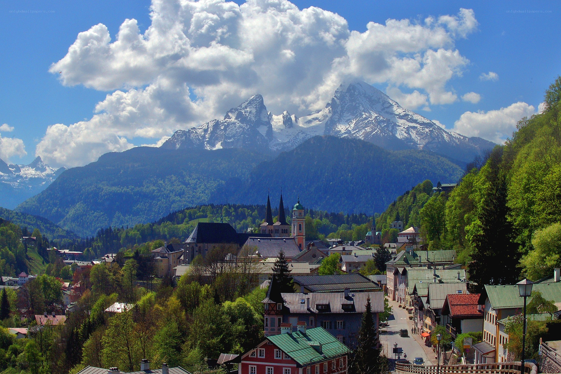 Alpine town with snow-capped mountains