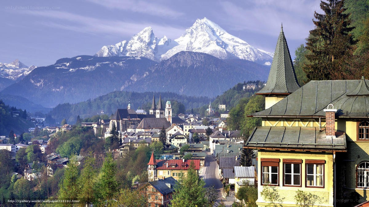 Alpine town with snow-capped mountains