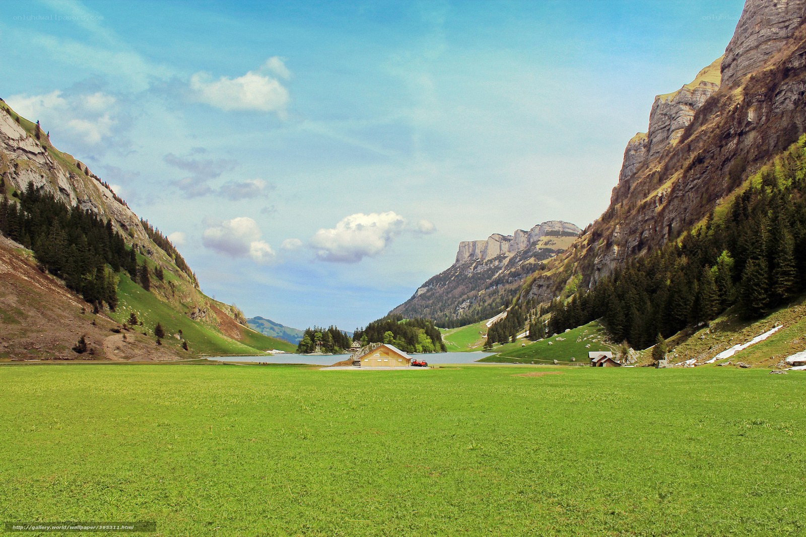 alpine valley with lake and cabin