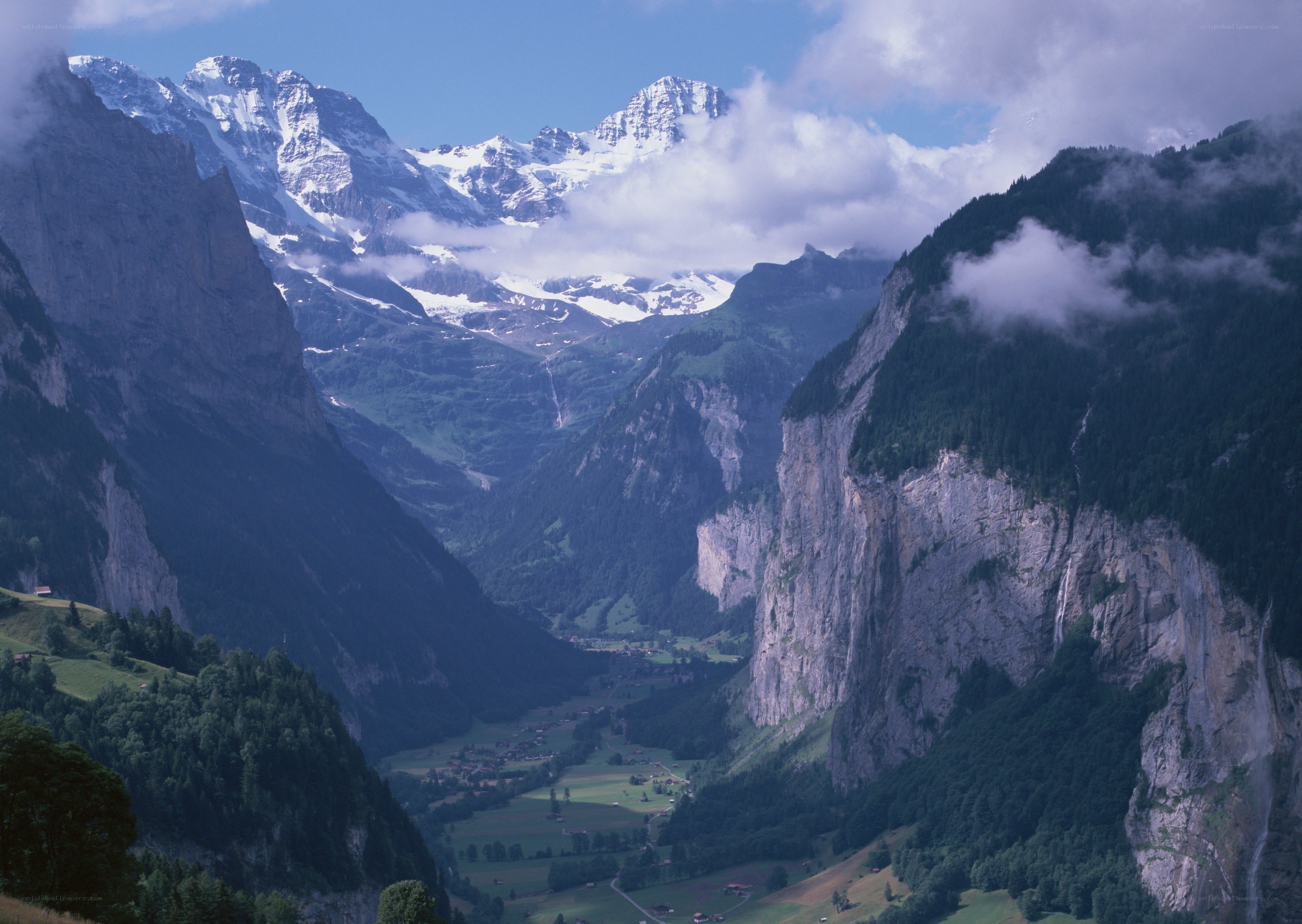 Alpine valley with snow-capped peaks