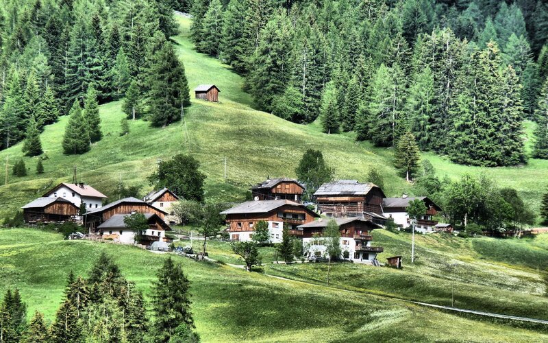 Alpine village nestled in green hills