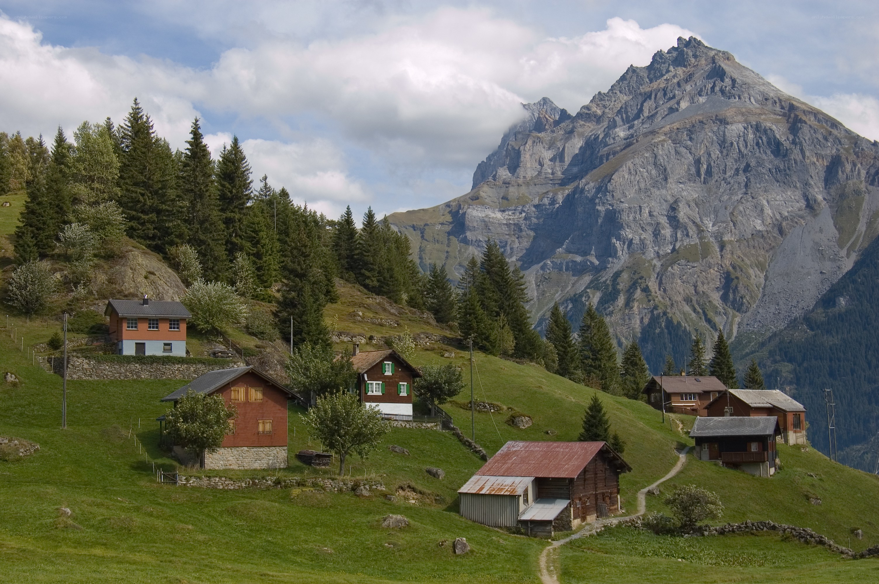 Alpine village with mountain backdrop