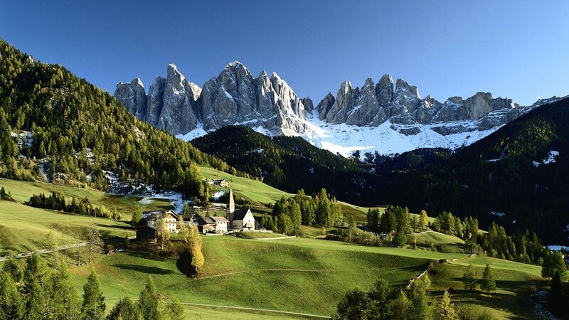 Alpine village with mountain backdrop
