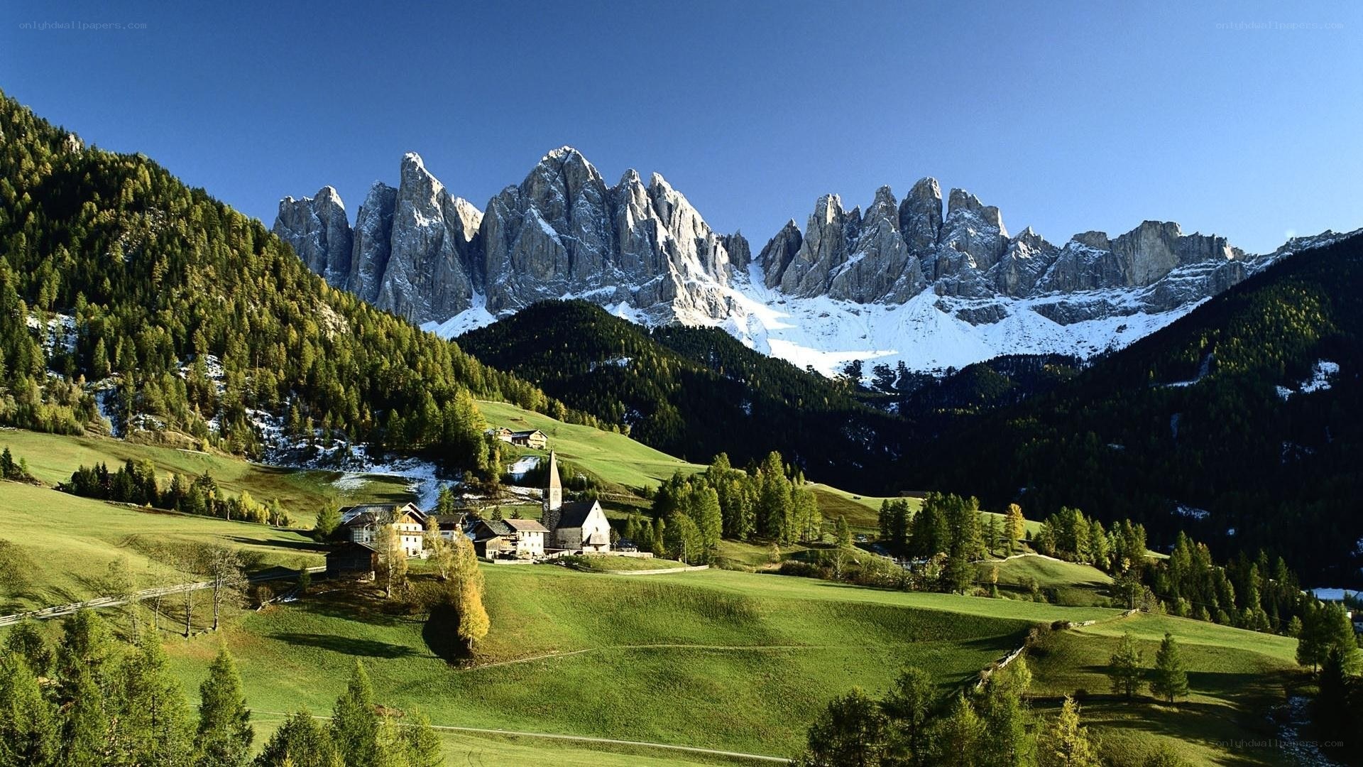 Alpine village with mountain backdrop