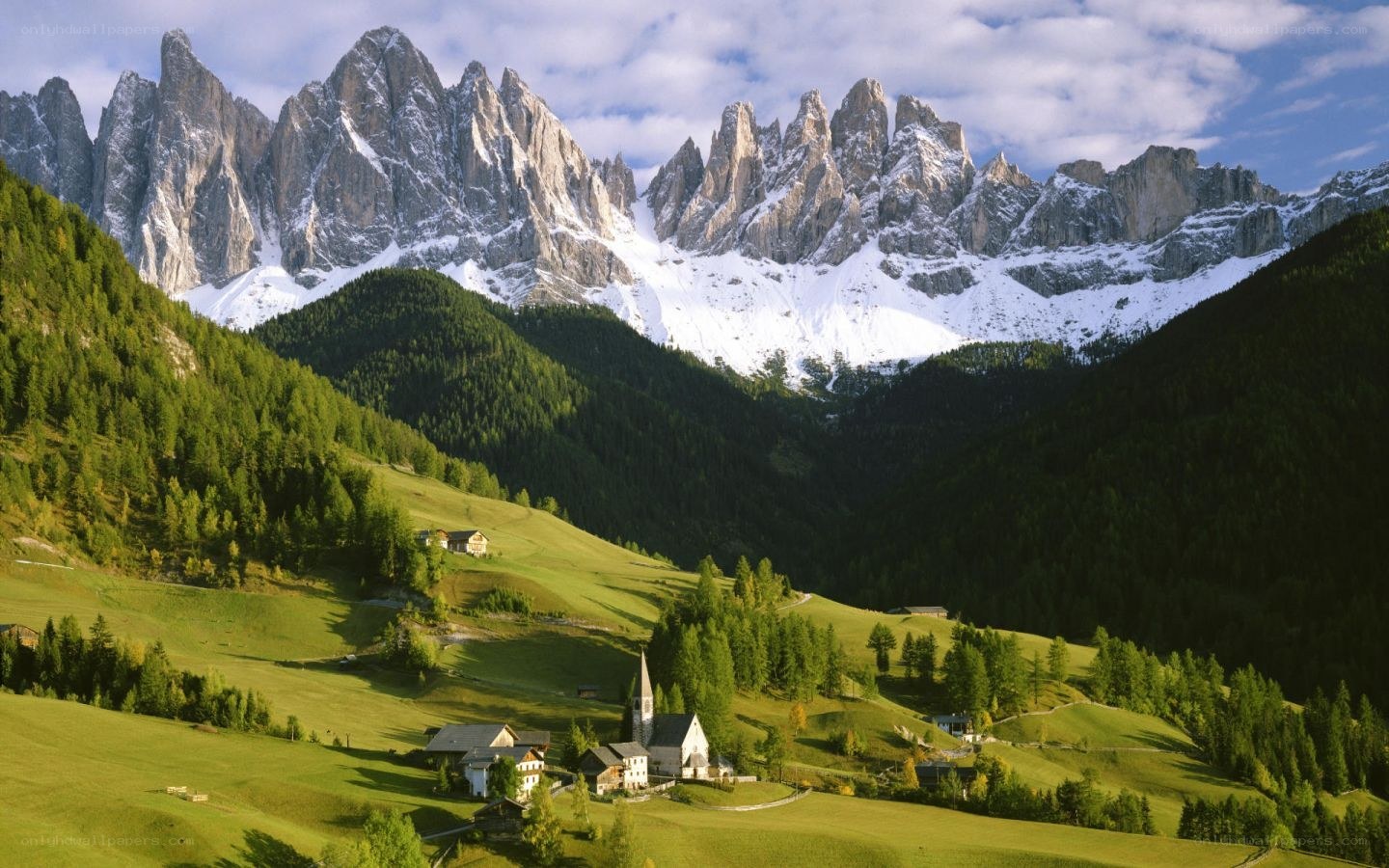 Alpine village with mountain backdrop